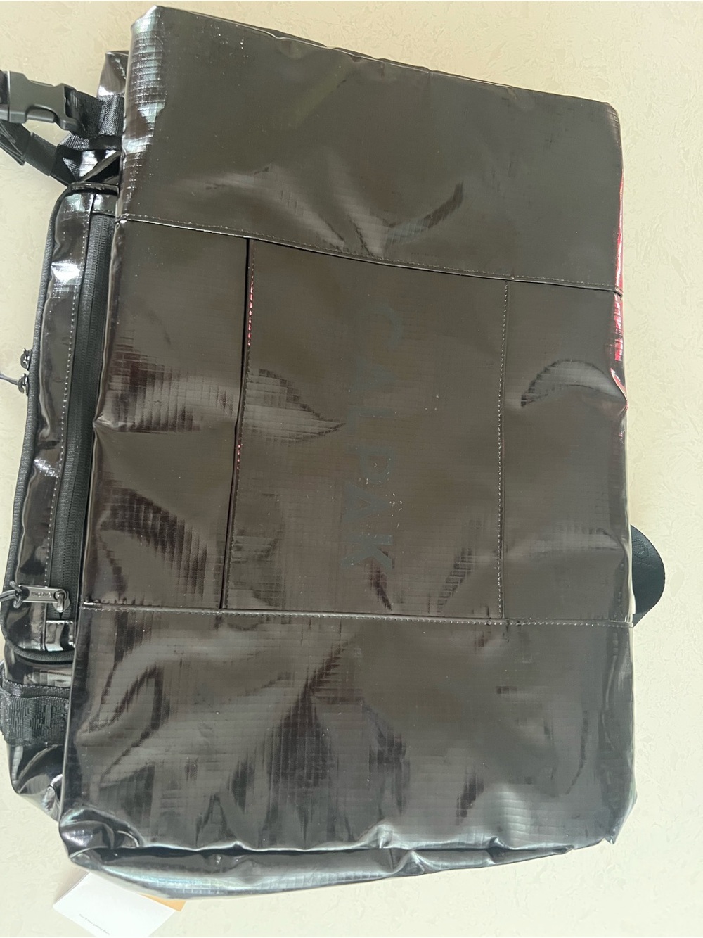 Calpack Duffle bag backpack. Patent black leather. Brand new. With tags